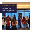 People gathered in an open room with tables set up. "Tapestry ERG Fair Supporting our employees."