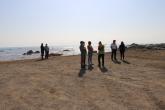 people standing on a beach