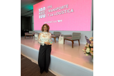 Francia Páramo holds her T21 100 Women in Transportation and Logistics 2026 award on stage following the recognition ceremony in Mexico City.