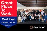 A group posed in a room. "Great Place to Work Certified" badge on the left.