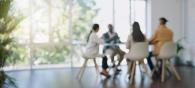 Coworkers meeting around a table