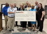 Representatives from KeyBank and IndyEast shown with a $750,000 grant check.