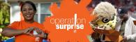 Operation Surprise logo: Woman holding her hands in the shape of a heart. Man opening a box.