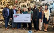 Representatives from KeyBank and Habitat for Humanity shown with a $300,000 grant check.