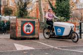 A person riding a cargo bike
