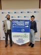 Two people holding winning banner
