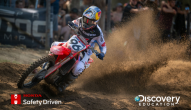 Red motorcycle driving down track