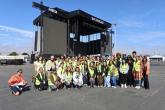 Students posed for a photo in front of the festival's main stage while on their exclusive festival grounds tour.