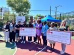 KeyBank and Keybank Foundation team members shown with grant checks.