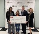 KeyBank Foundation members present a check to the Northeastern Food Bank.
