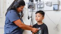 Caption: A healthcare worker at Mālama I Ke Ola health center provides services to a young patient. The health center received a $1 million grant from Direct Relief to continue and expand vital health services to the community after devastating wildfires broke out last August. (Courtesy photo)