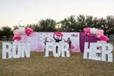 Sign reading "RUN FOR HER"