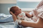 Mother holding a newborn baby.