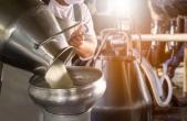 milk being poured in a factory
