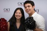 Two people at CACI's National Intern Day celebration