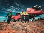 Three people standing outside near CASE IH equipment