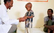 Nuredin, a staff member at the Action Against Hunger-supported health clinic, takes joy in helping Gebremedihin’s son recover.