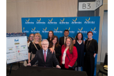 DP World's Canada employees pose at step and repeat for Arthritis Society Canada event.