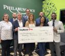 KeyBank presents a check in the amount of $20,000 to Philabundance Inc. From left to right: From left to right: Julie Vetack, Key@Work Relationship Manager, KeyBank; Robert Lombardo, Area Retail Leader, KeyBank; Jamie Tranfalia, Market President, KeyBank; Scott Fremont, Director of Individual Giving, Philabundance; Kristine DelMonte, Chief Development Officer, Philabundance; Juan Hurtado, Branch Manager, KeyBank; Loree D. Jones Brown, CEO Philabundance and Chiwuike Owunwanne, Corporate Responsibility Office
