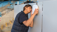 Noor Zafar installing a piece of equipment.
