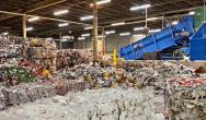 Truck dropping off a load at recycling facility