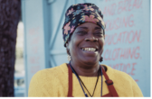 Smiling woman wearing an apron