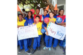 students holding up signs