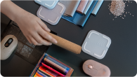 desk with hands and Logitech products shown on top