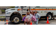 kids in front of a work truck