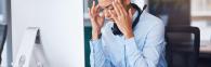 Stressed office worker in front of computer