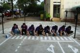 A group of people painting a crosswalk