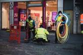 employees on street with cables