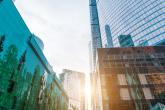 Sunlight peeking through high rise commercial buildings