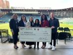 group holding up honorary check
