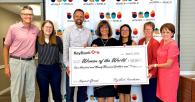Women of the World check presentation by the KeyBank team.