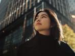 Woman standing outside in a city
