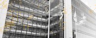 Outside of office building with American flag flying.