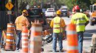 Photo of transportation workers on roadside