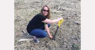 Anna planting a tree.