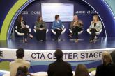 panel of people sitting on a stage
