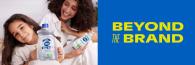 An adult and child holding Dial soap, with text "Beyond the Brand"