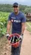 PSEG volunteer with a basket of eggplant