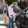 person charging a car