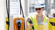 National Grid employee using an EV charger