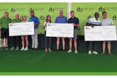 people holding up charity checks