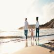 Family walking on the beach