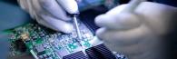 person working on circuit board
