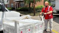 Salvation Army trucks, boxes, and volunteer