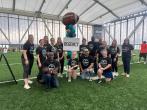 Volunteers posed in an indoor stadium