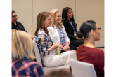 Women seated at an event